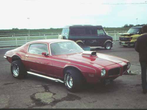 red 70's Camaro